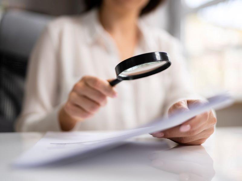 Woman examining written evidence