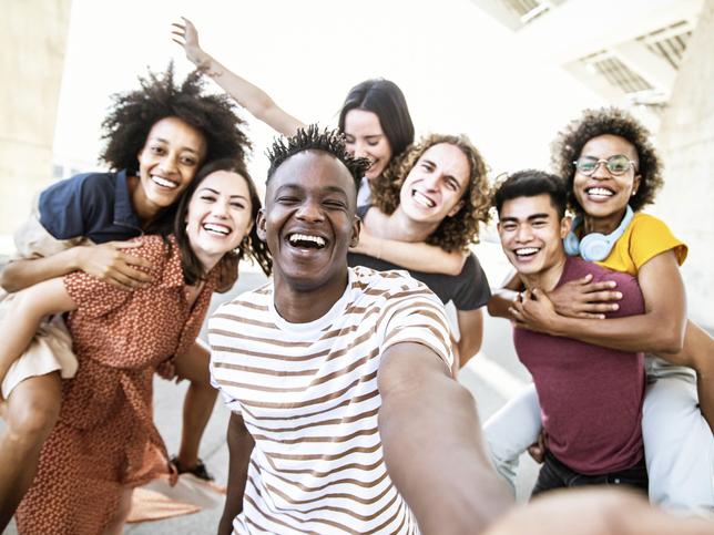 Group of multiracial university students laughing