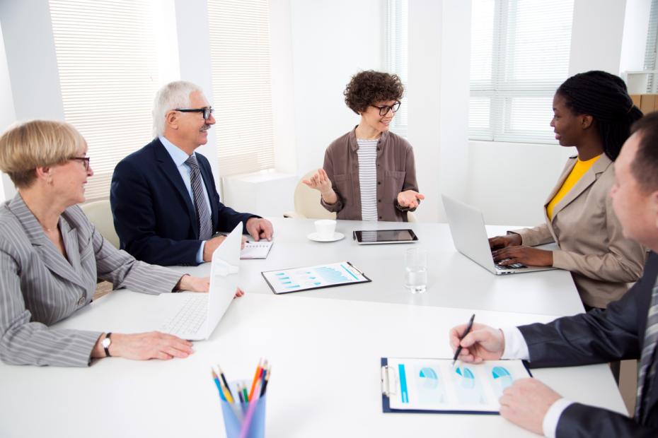 A group of policymakers discussing research