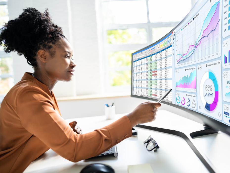 Student analysing graphs and data sets on a large screen