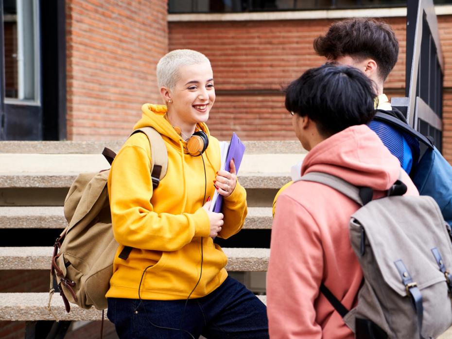 Students standing outside a campus building