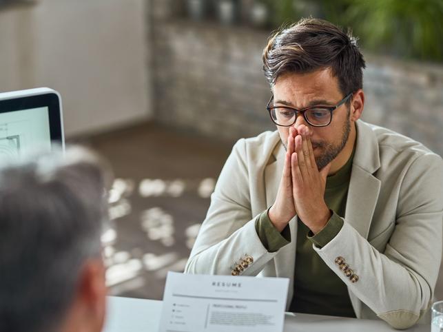 Young man having stressful job interview