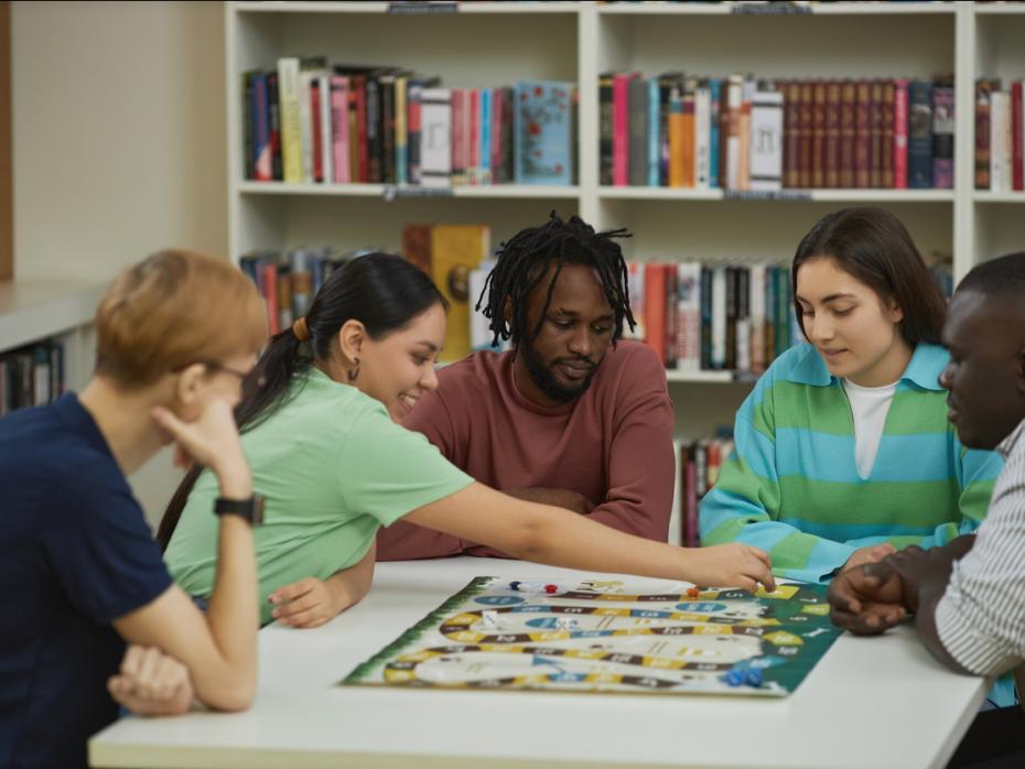 Students playing a board game