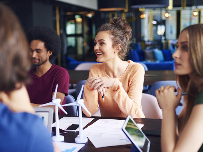 Young people in a meeting to discuss sustainability