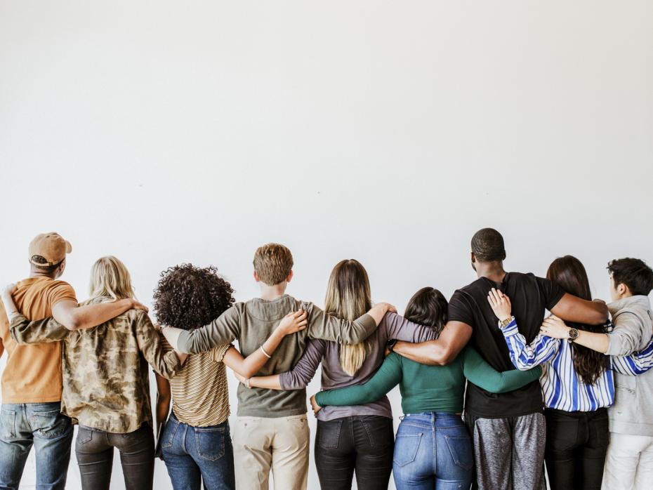 Students with their arms around each other from behind