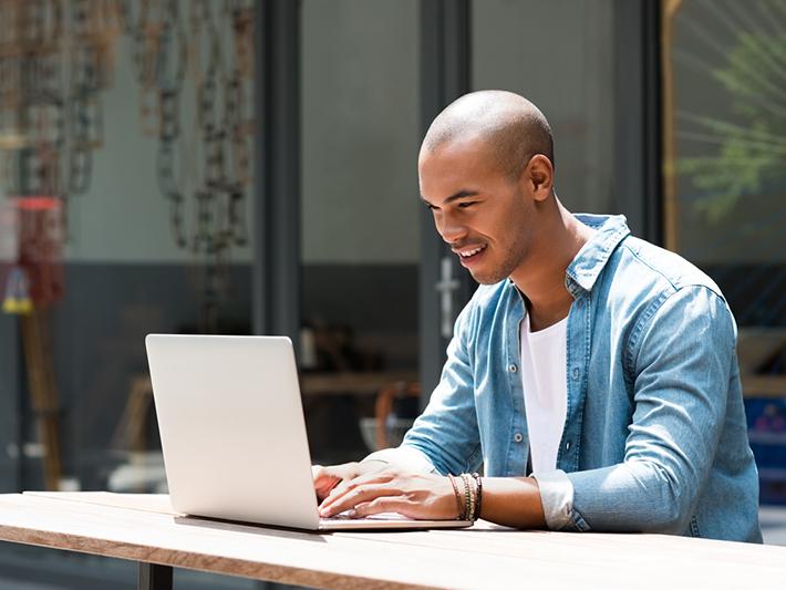 Young man working at laptop