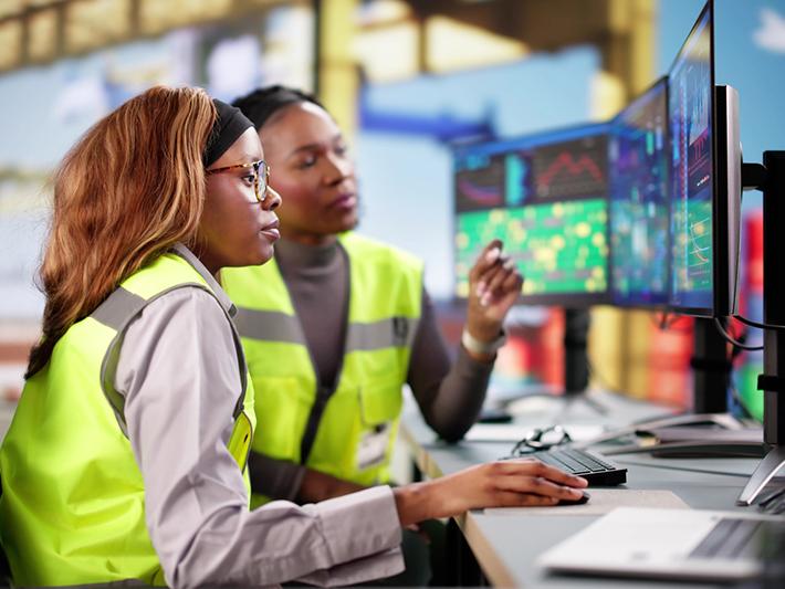 Young black woman and older woman working on logistics
