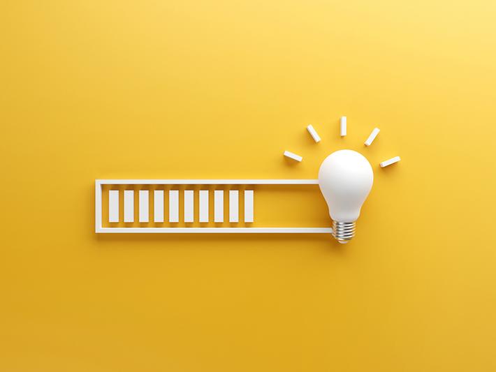 Loading illustration leading to lightbulb on yellow background
