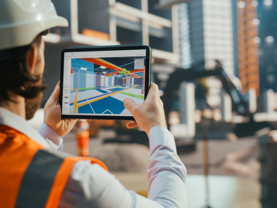 Industrial engineer inspecting a residential construction project with a VR app with a virtualisation of the building's interior