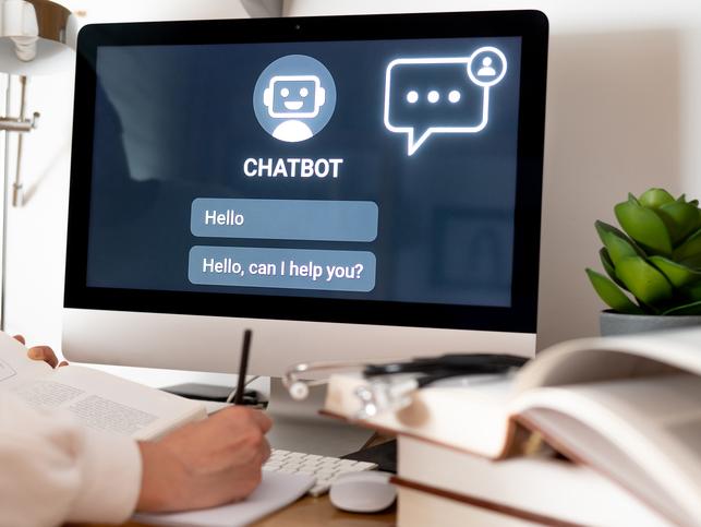 A doctor uses a chatbot on a desktop screen