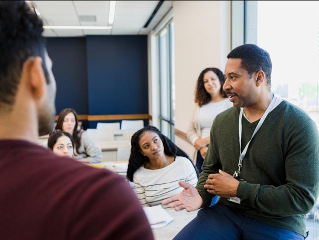 A teacher addresses a classroom informally