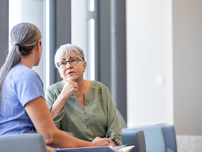 Health worker talks to a patient