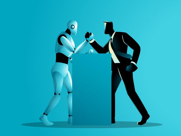 A robot and a man in a business suit arm wrestle