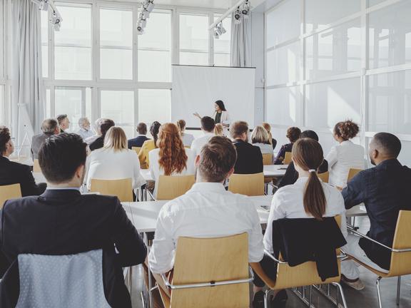 A talk in a large windowed room