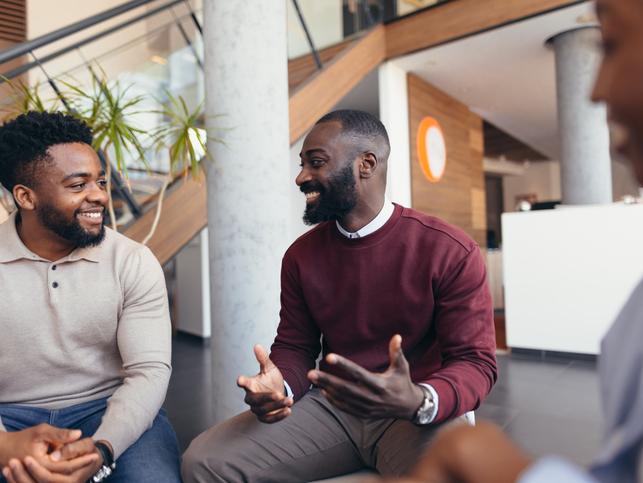 Black academics talk in a circle