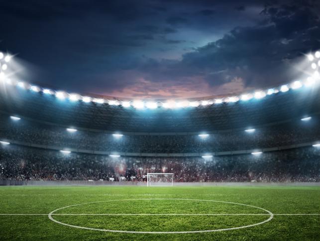 An empty football stadium at night