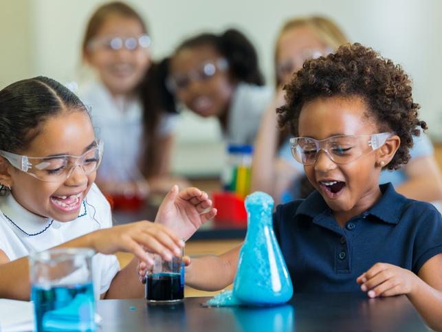 Two primary school students doing a science experiment