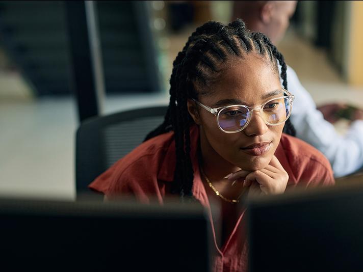 Black female professional working at computer