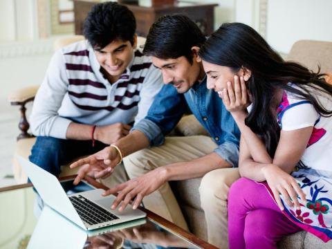 Students working together at laptop