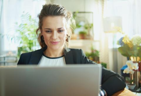 Woman academic working at her laptop