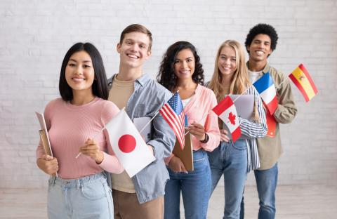 Five students wave national flags