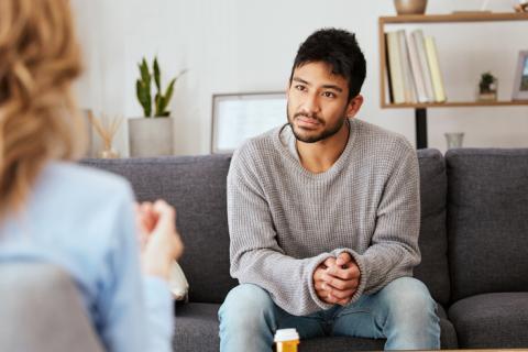 Young man in conversation with supervisor