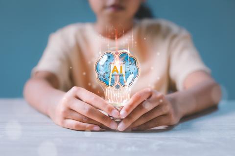 Student looking at a hologram of a brain 