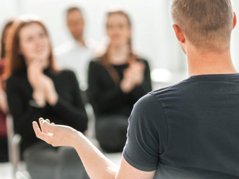 Group of students taking part in a classroom debate