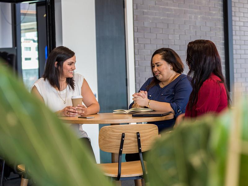 Group of three women talking