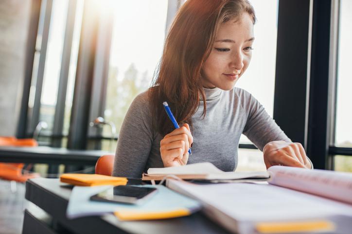 Female Asian students studying for an exam