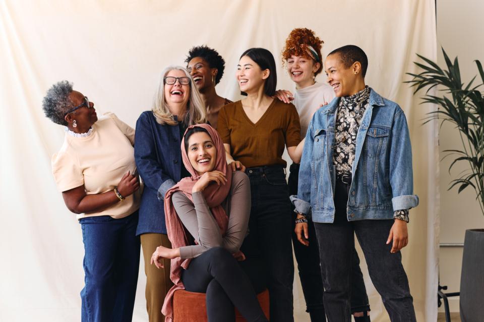 A group of students smiling at eachother