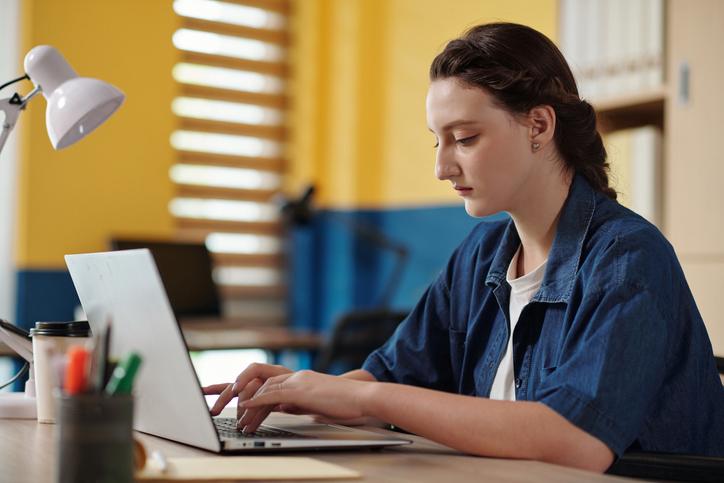 female student working on laptop