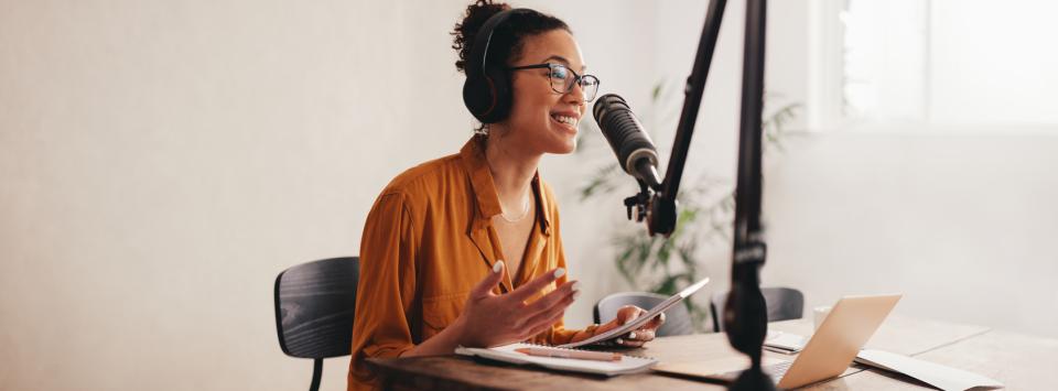 A podcast host speaing to an unseen interviewee
