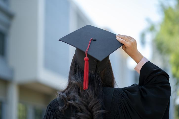 A graduate wearing a mortarboard