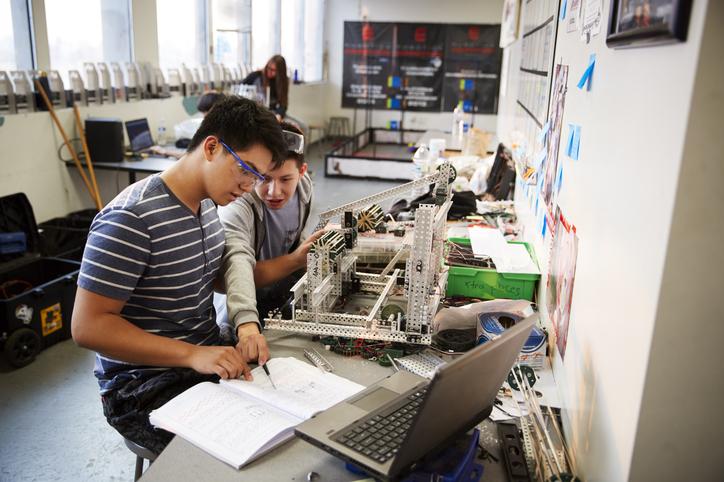 Two engineering students work together on a project