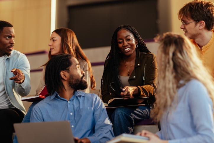 Students discuss with their lecturer
