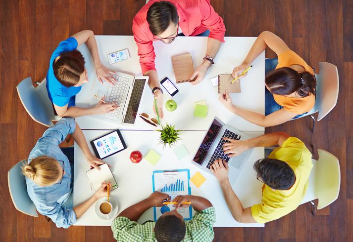 Students work round a square table