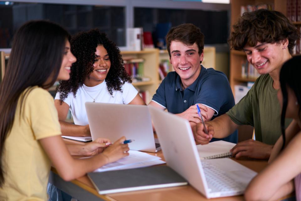 A group of university students working together at a table