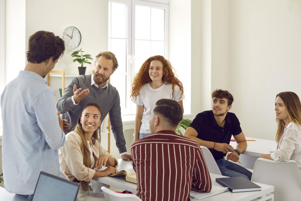 Professors in a classroom having a meeting 