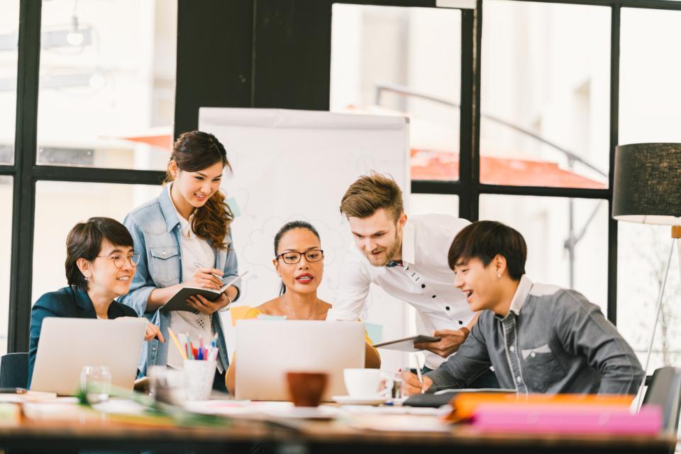 A group of students in a classroom working on a live brief