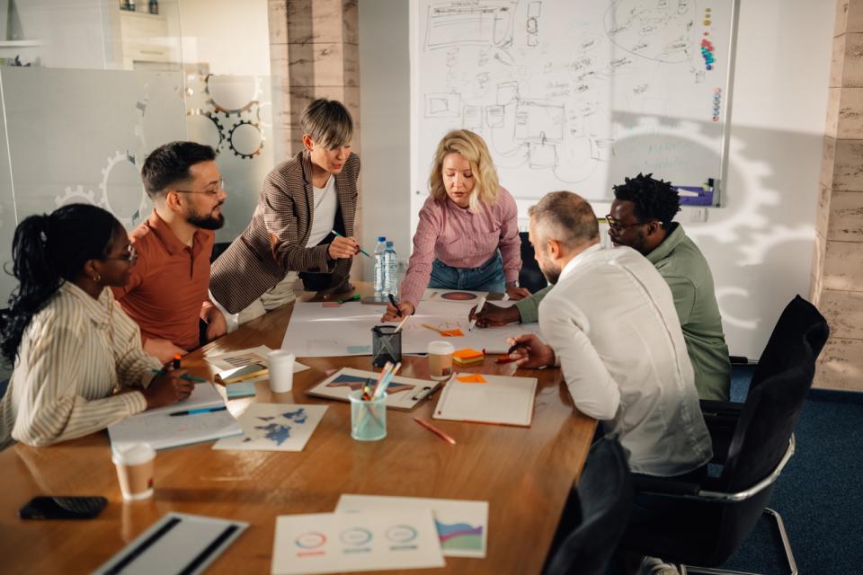 A team brainstorming around a large table