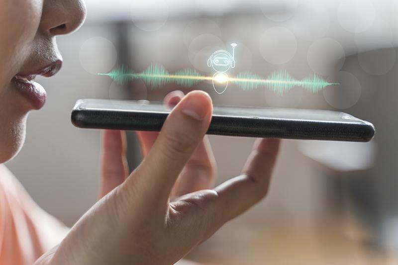 Woman talking into smartphone, AI as student support