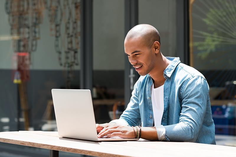 Young man working at laptop
