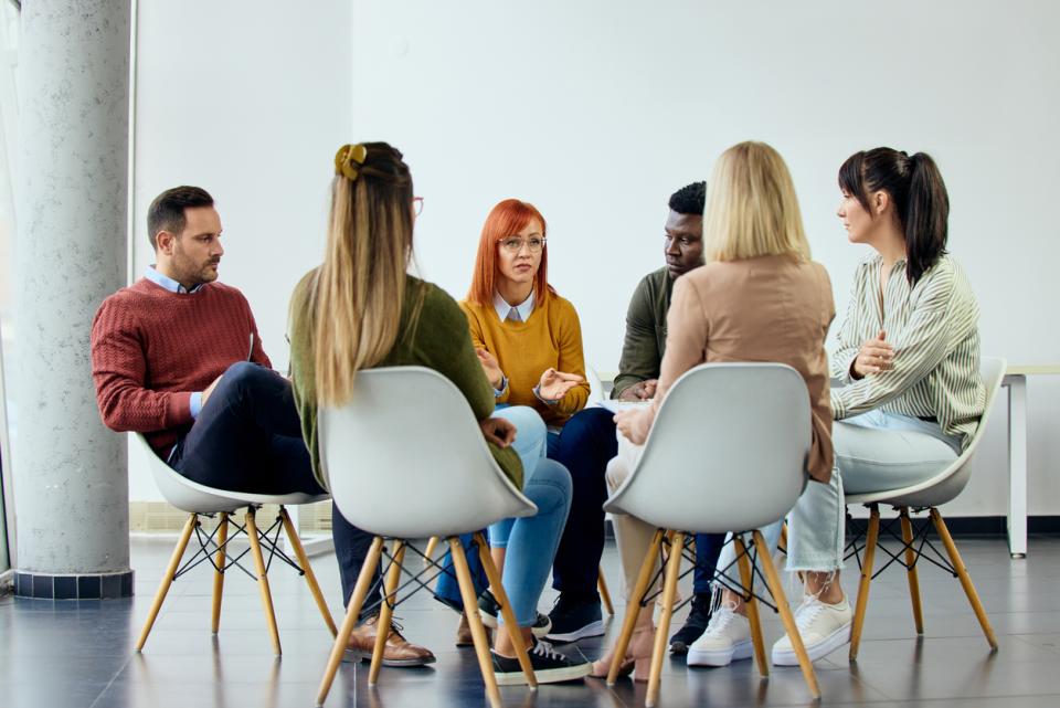 A group of research participants sitting in a circle