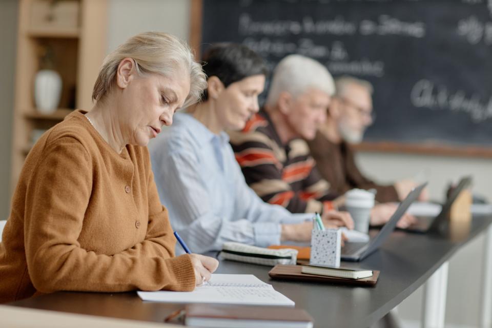 A group of faculty writing together.