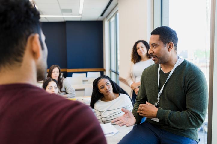 A teacher addresses a classroom informally