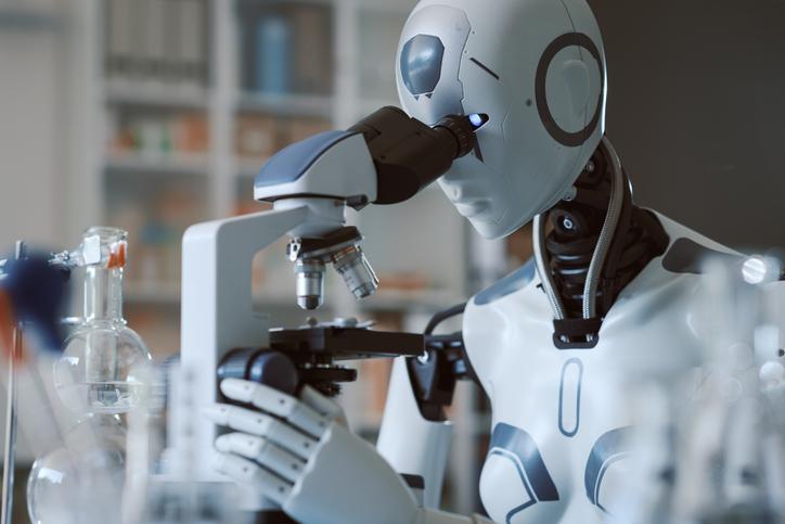 A robot uses a microscope in a laboratory