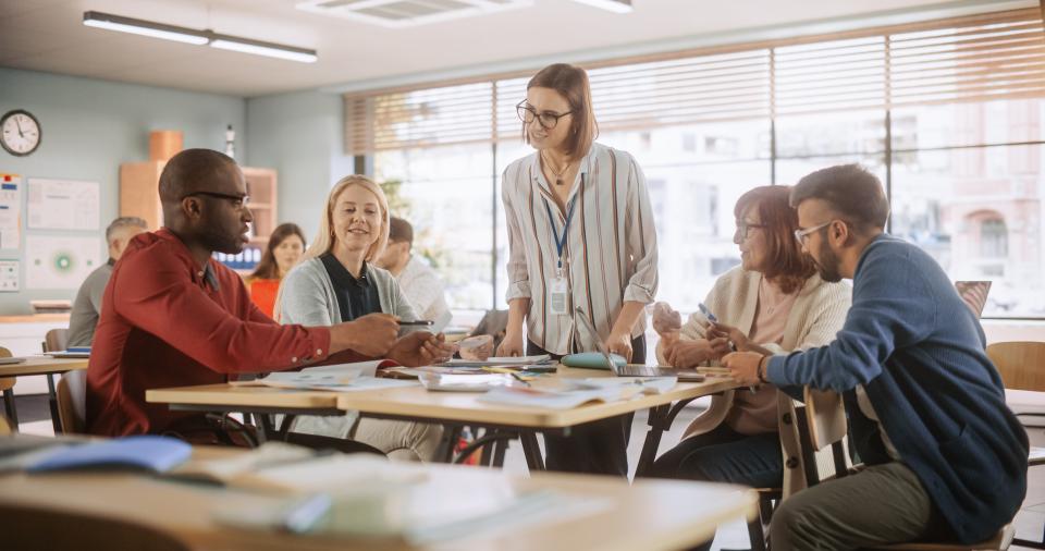 Female lecturer addresses a group of students