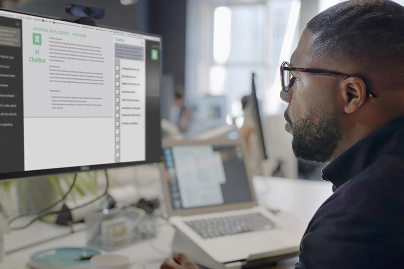 Black man working at computer using AI chatbot