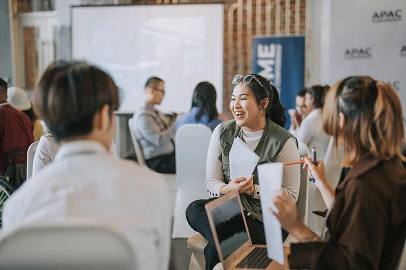 Asian students articipating in small-group discussion